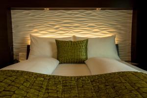 Ένα ή περισσότερα κρεβάτια σε δωμάτιο στο Airport Hotel Basel - Convenient & Friendly