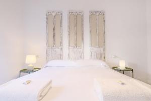 Ein Bett oder Betten in einem Zimmer der Unterkunft Casa del Portillo-Centro Histórico