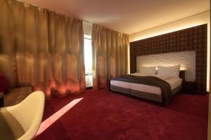 Ένα ή περισσότερα κρεβάτια σε δωμάτιο στο Airport Hotel Basel - Convenient & Friendly