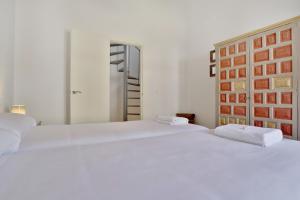 Ein Bett oder Betten in einem Zimmer der Unterkunft Casa del Portillo-Centro Histórico