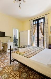 Ένα ή περισσότερα κρεβάτια σε δωμάτιο στο Villa Lavinia