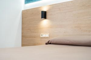 Postel nebo postele na pokoji v ubytování Hotel Arena Prado