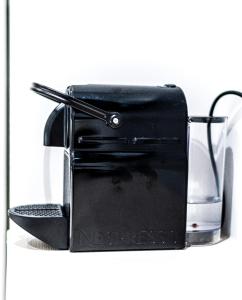 a black toaster sitting on top of a shelf at NOX West Hampstead in London