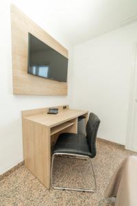 TV a/nebo společenská místnost v ubytování Hotel Arena Prado