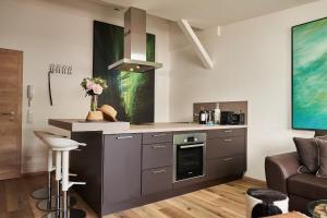 Kuchyň nebo kuchyňský kout v ubytování KitzHome City Apartments