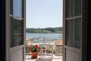 a view of a harbor from an open window at Punti di Vista in Portovenere