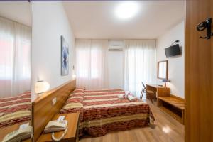 TV a/nebo společenská místnost v ubytování Hotel Stoccarda