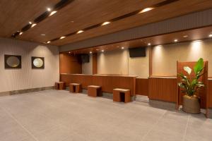 a waiting room with a podium and a stage at Dormy Inn Osaka Tanimachi in Osaka