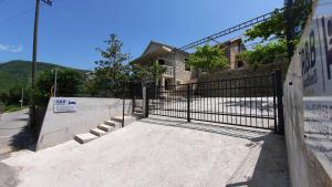a gate in front of a house at R&B Apartments in Budva