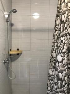 a bathroom with a shower with a shower curtain at Mini-hotel Zefir in Zatoka +53 photos