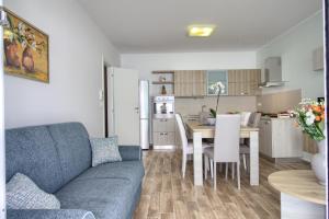 A kitchen or kitchenette at Jacuzzi Holiday Homes by LoveSud