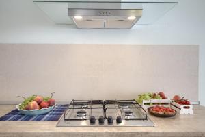 A kitchen or kitchenette at Jacuzzi Holiday Homes by LoveSud