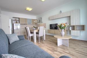 A kitchen or kitchenette at Jacuzzi Holiday Homes by LoveSud