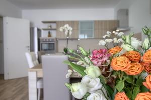 A kitchen or kitchenette at Jacuzzi Holiday Homes by LoveSud