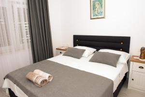 Posteľ alebo postele v izbe v ubytovaní Apartments Drago Kovačić