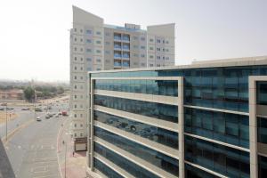 an office building with a lot of windows at Al Barsha New 2Bedroom plus maidR near MOE in Dubai