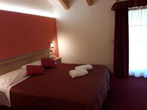 Postel nebo postele na pokoji v ubytování Hotel Bellaria