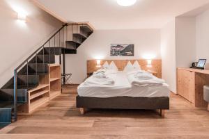 Säng eller sängar i ett rum på B&B Boutique Apartment Oberwiesen