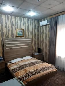Postel nebo postele na pokoji v ubytování AZPETROL HOTEL GAZAX