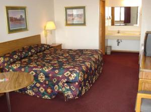 Postel nebo postele na pokoji v ubytování Yorkshire Motel