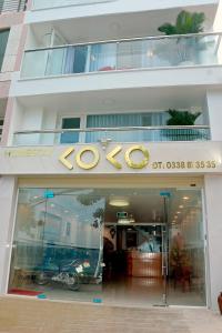 a store front of a building with a sign on it at Homestay coco in Vung Tau