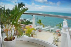 a balcony with a view of the ocean at Homestay coco in Vung Tau