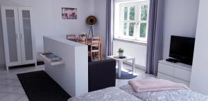 TV a/nebo společenská místnost v ubytování Apartment Donaublick