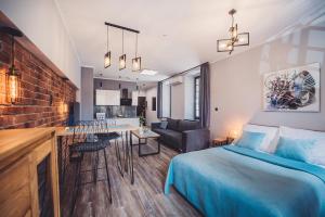 Posteľ alebo postele v izbe v ubytovaní Apartamenty Świętego Jakuba