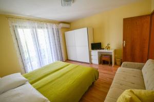 TV a/nebo společenská místnost v ubytování Jutta Apartment