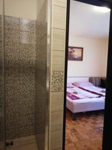 Postel nebo postele na pokoji v ubytování Apartment Mara