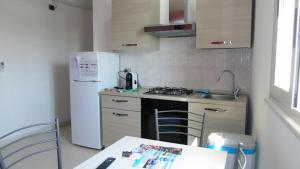 A kitchen or kitchenette at Casa Vacanza Miramare