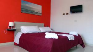 A bed or beds in a room at Casa Vacanza Miramare