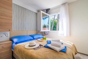 Postel nebo postele na pokoji v ubytování Centinera Deluxe Mobile Homes