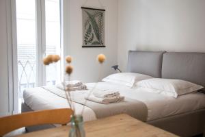 a bedroom with a bed with a table and a couch at Pietrapiana Boutique Apartments in Florence