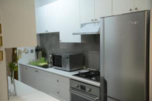 Кухня или мини-кухня в Crambero Suites
