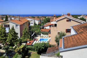 a view of a city with houses and a swimming pool at Apartment Panorama in Poreč