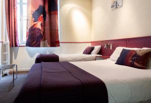 Letto o letti in una camera di Hotel Mignon