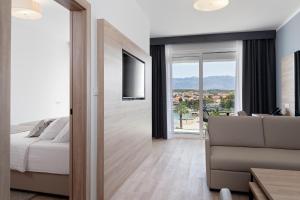 Voodi või voodid majutusasutuse Kaneo beach hotel Novalja toas