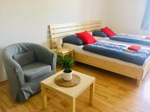 Postel nebo postele na pokoji v ubytování Apartmany a Ubytovani Mlynice Litovel