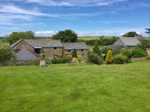 A garden outside Polean Farm Cottages - With Free Animal Feeding and Pony Rides and Free Access to a Nearby Pool