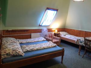 Ліжко або ліжка в номері Triniti Vendégház