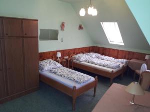 Posteľ alebo postele v izbe v ubytovaní Triniti Vendégház