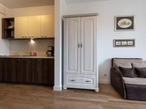Η κουζίνα ή μικρή κουζίνα στο VacationClub – Aquamarina Apartament C-19