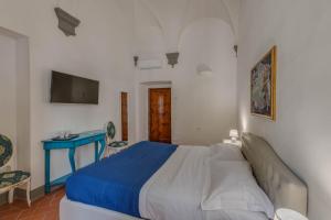 A bed or beds in a room at Residenza d'Epoca Galleria dell'Accademia