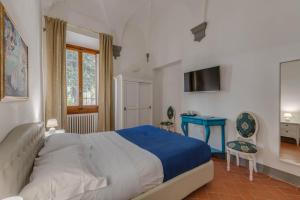 A bed or beds in a room at Residenza d'Epoca Galleria dell'Accademia