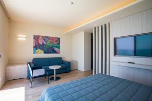 TV a/nebo společenská místnost v ubytování Hotel Ancora