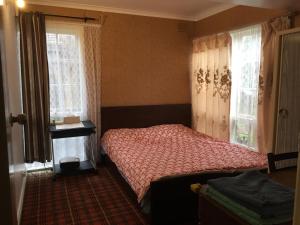 Postel nebo postele na pokoji v ubytování ADA Homestay