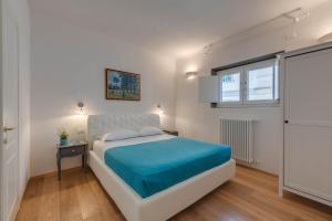 A bed or beds in a room at Residenza D'Epoca Historia Luxury Boutique