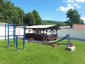 a park with a playground with a gazebo at A1 Štart in Starý Smokovec