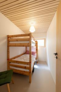 a bedroom with bunk beds in a house at Zu Gast bei den Hagspiels in Hittisau